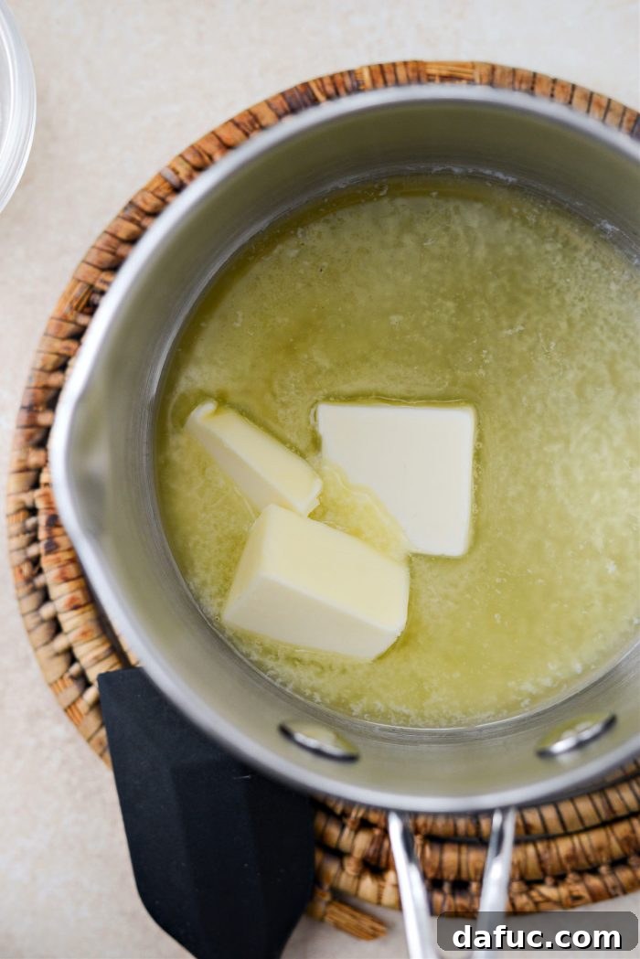 Melting 3 tablespoons of Irish butter in a saucepan