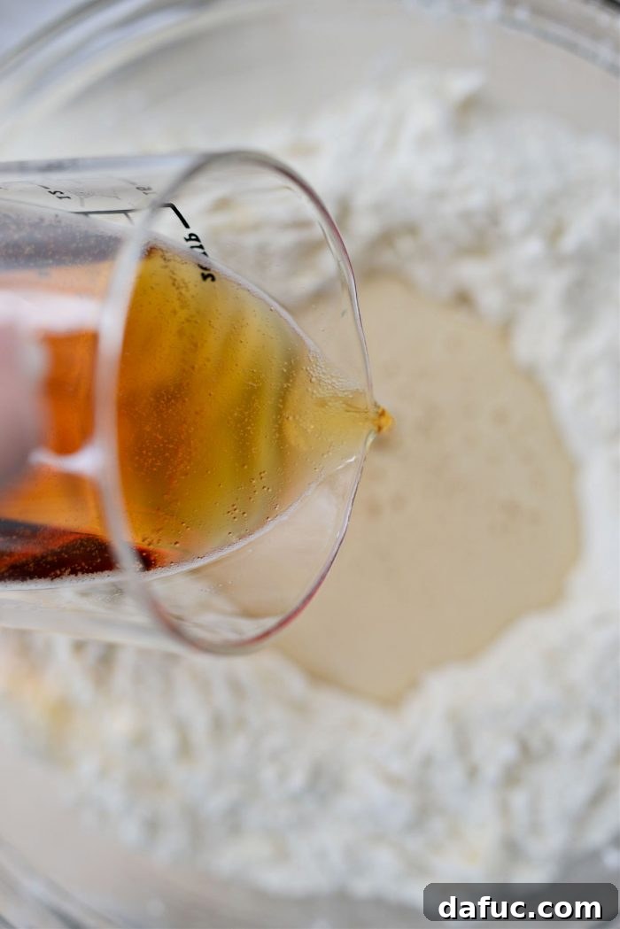 Making a well in dry ingredients and pouring in beer