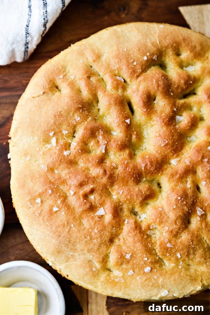 Homemade Focaccia bread, golden brown with a crispy crust.