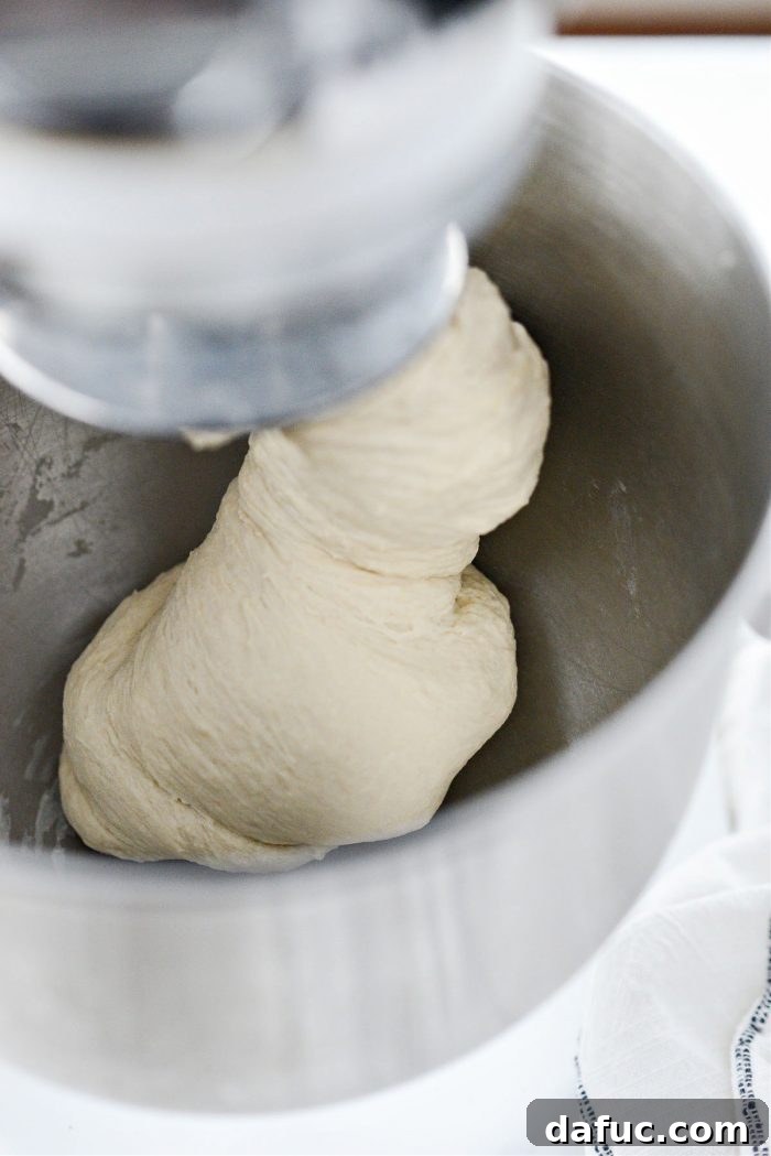 Dough mixing for 4 minutes until smooth.