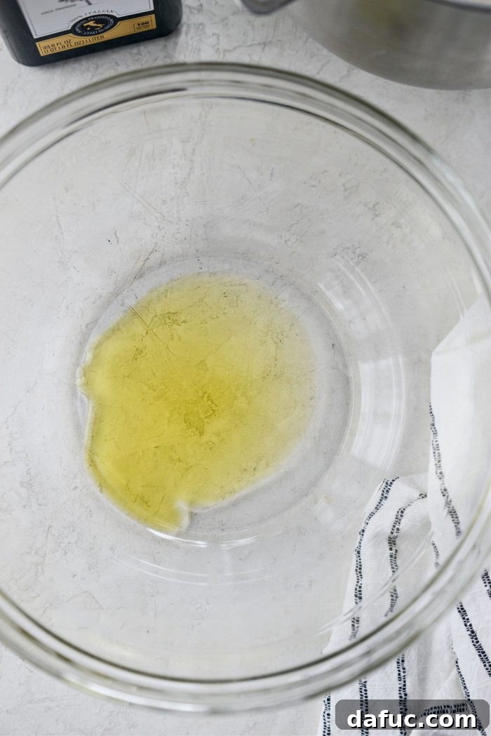 Olive oil in a large mixing bowl.