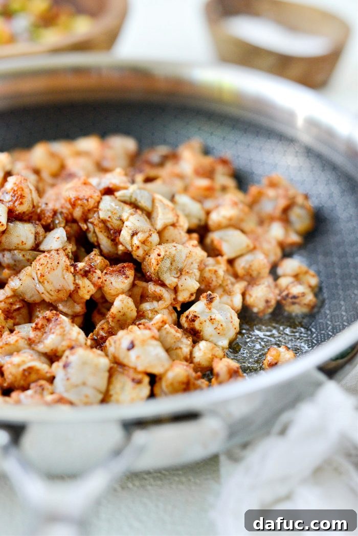 Sunshine Shrimp Tacos 8 Frying seasoned shrimp in a hot pan