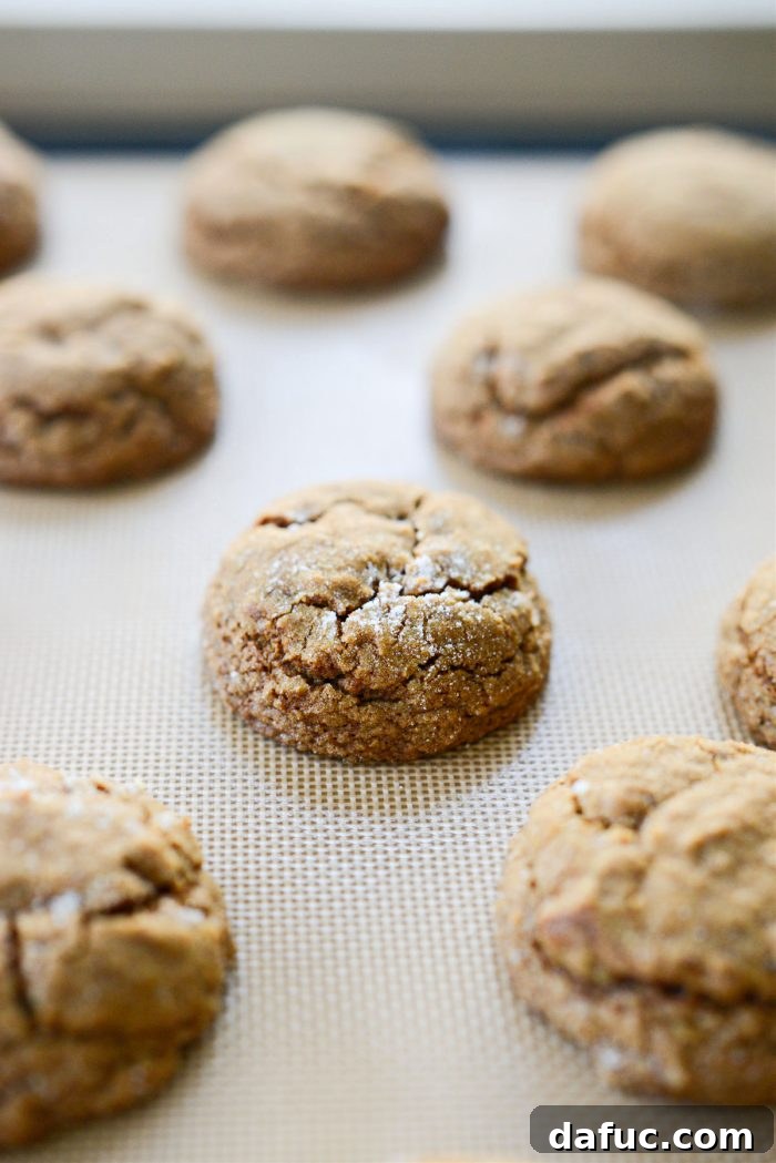 Spiced Pumpkin Molasses Chews 20 A baking sheet filled with perfectly baked Pumpkin Molasses Cookies, golden brown and puffed.
