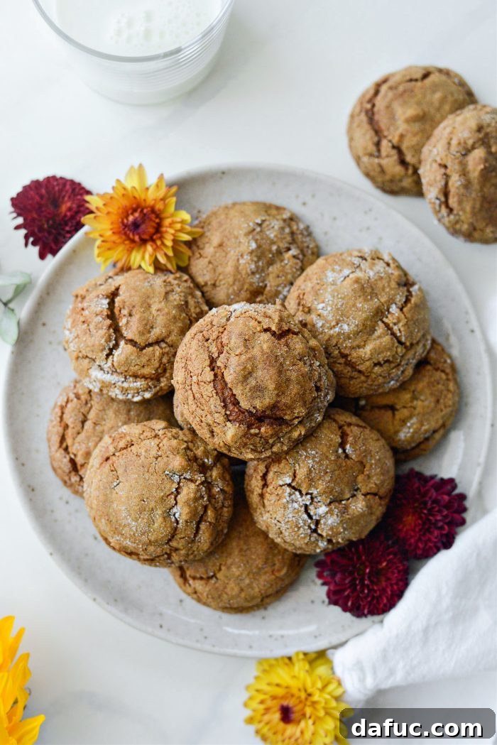 Spiced Pumpkin Molasses Chews 22 A plate generously piled with golden-brown Pumpkin Molasses Cookies.