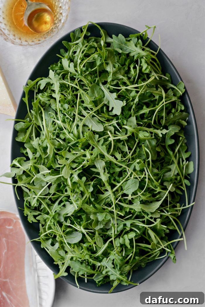 Arugula plated in a serving bowl