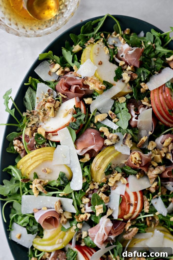 Pear and Prosciutto Arugula Salad assembled with garnishes