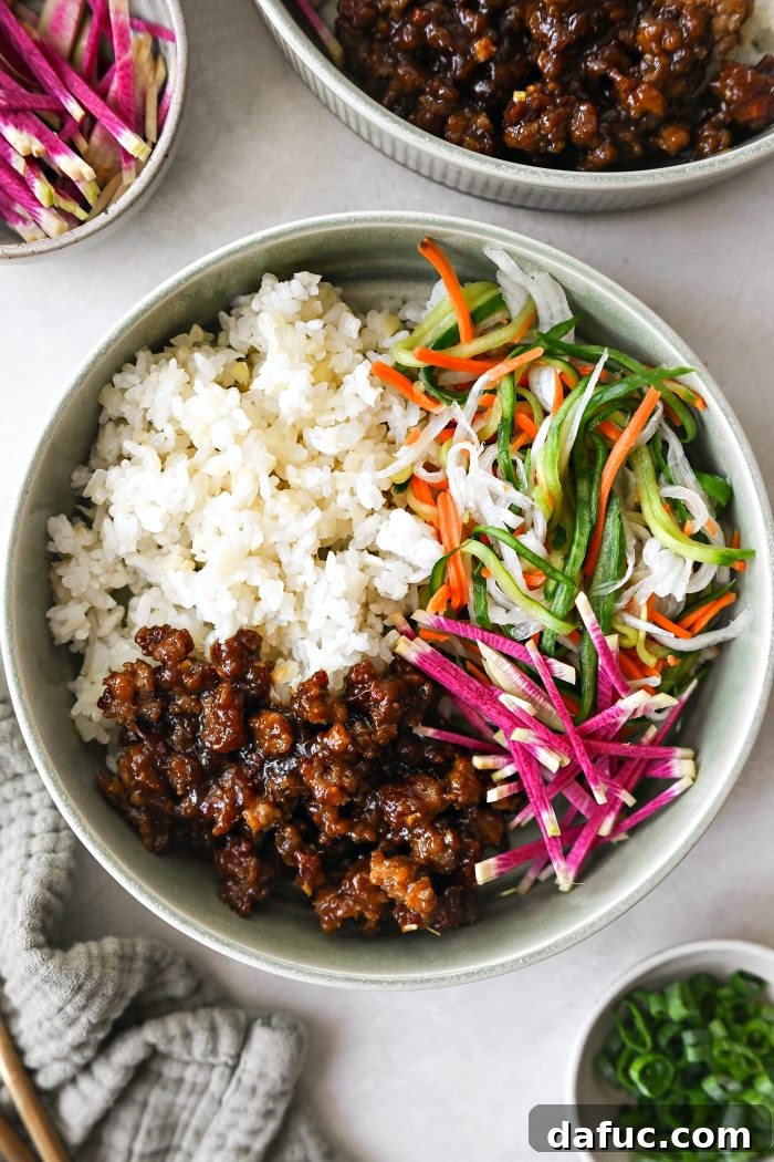 add cauliflower sushi rice, veggies and pork in bowl