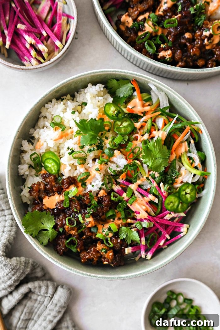 drizzle with spicy may and top with green onions and cilantro