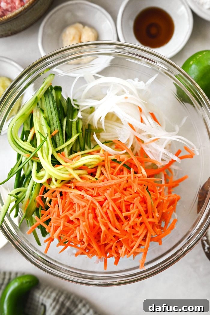 add in cucumber, daikon and carrot ribbons